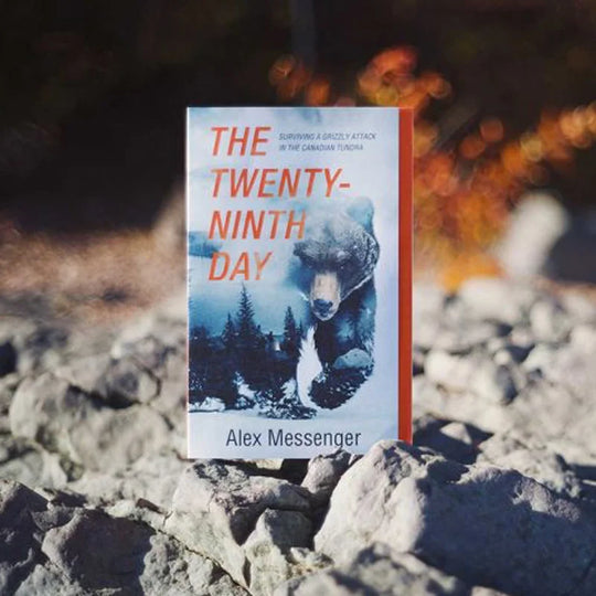 The Twenty Ninth Day: Surviving A Grizzly Attack In The Canadian Tundra by Alex Messenger with rocky landscape background