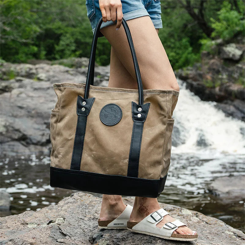 Lake Ontario Highlander Tote Black Trim and Wax Khaki Held by Woman