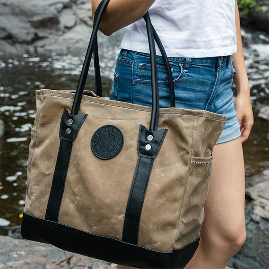 Lake Ontario Highlander Tote Black Trim and Wax Khaki Held by Woman